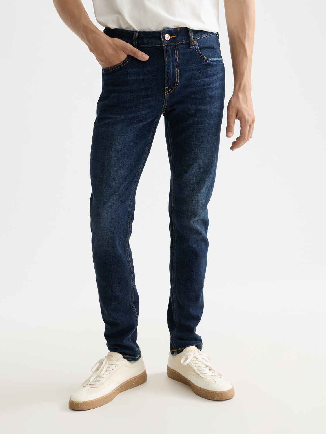 SCOTCH & SODA skim skinny-fit denim jeans displayed on a hanger, showcasing classic blue wash and slim silhouette.