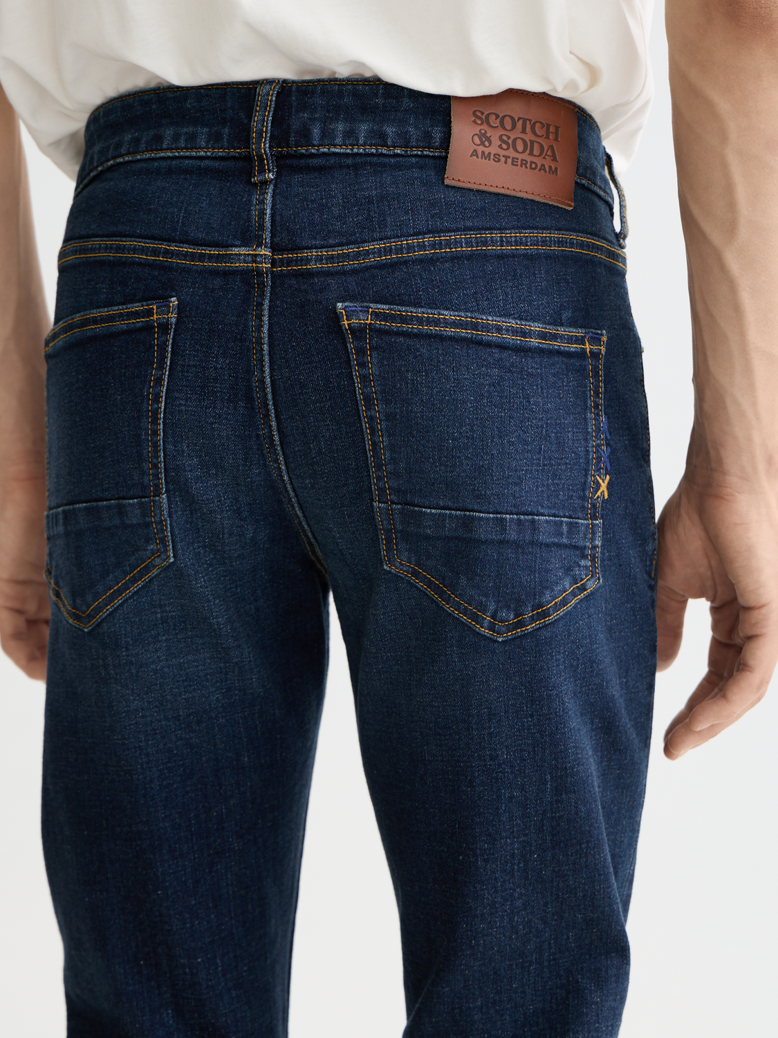 Slim-fit denim jeans from Scotch & Soda featuring a modern skinny silhouette and classic blue wash.
