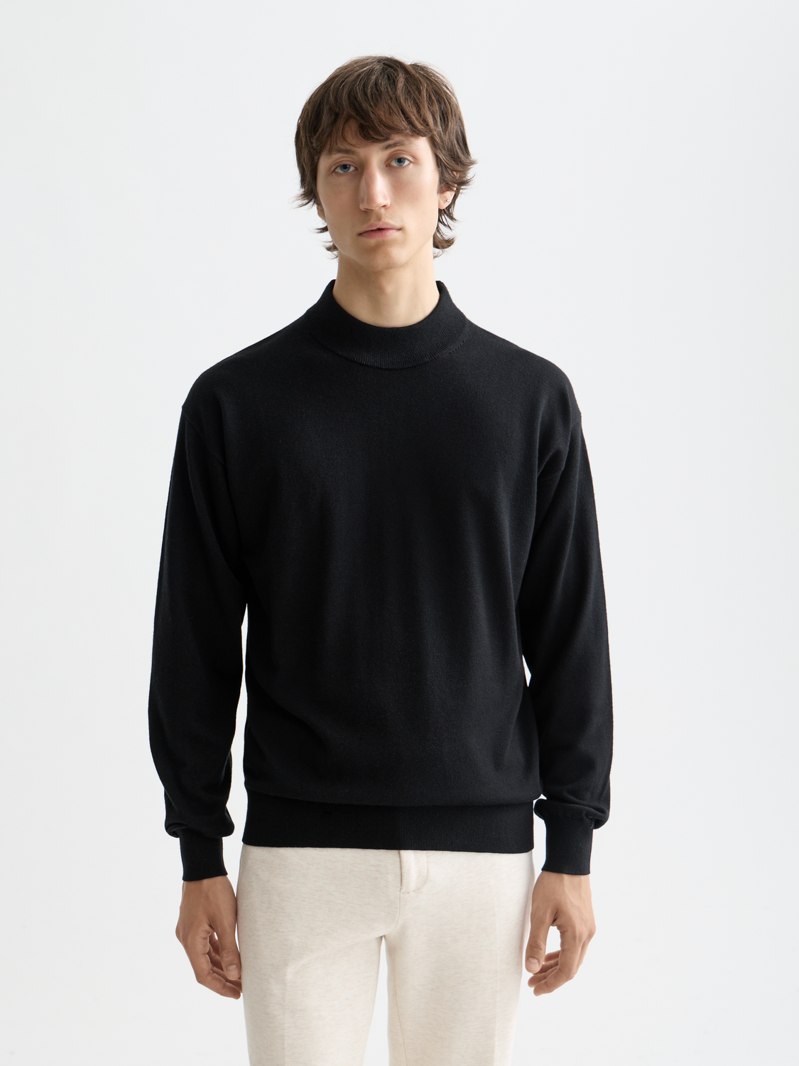 Scarlet knitwear mock neck sweater by Scotch & Soda, soft fabric with ribbed collar and long sleeves, close-up detail image.