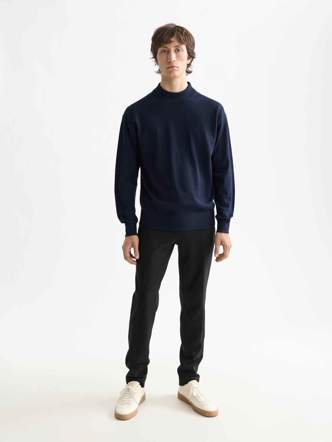 SCOTCH & SODA knitwear mock neck sweater in cozy fabric, close-up of the ribbed collar and textured knit pattern.