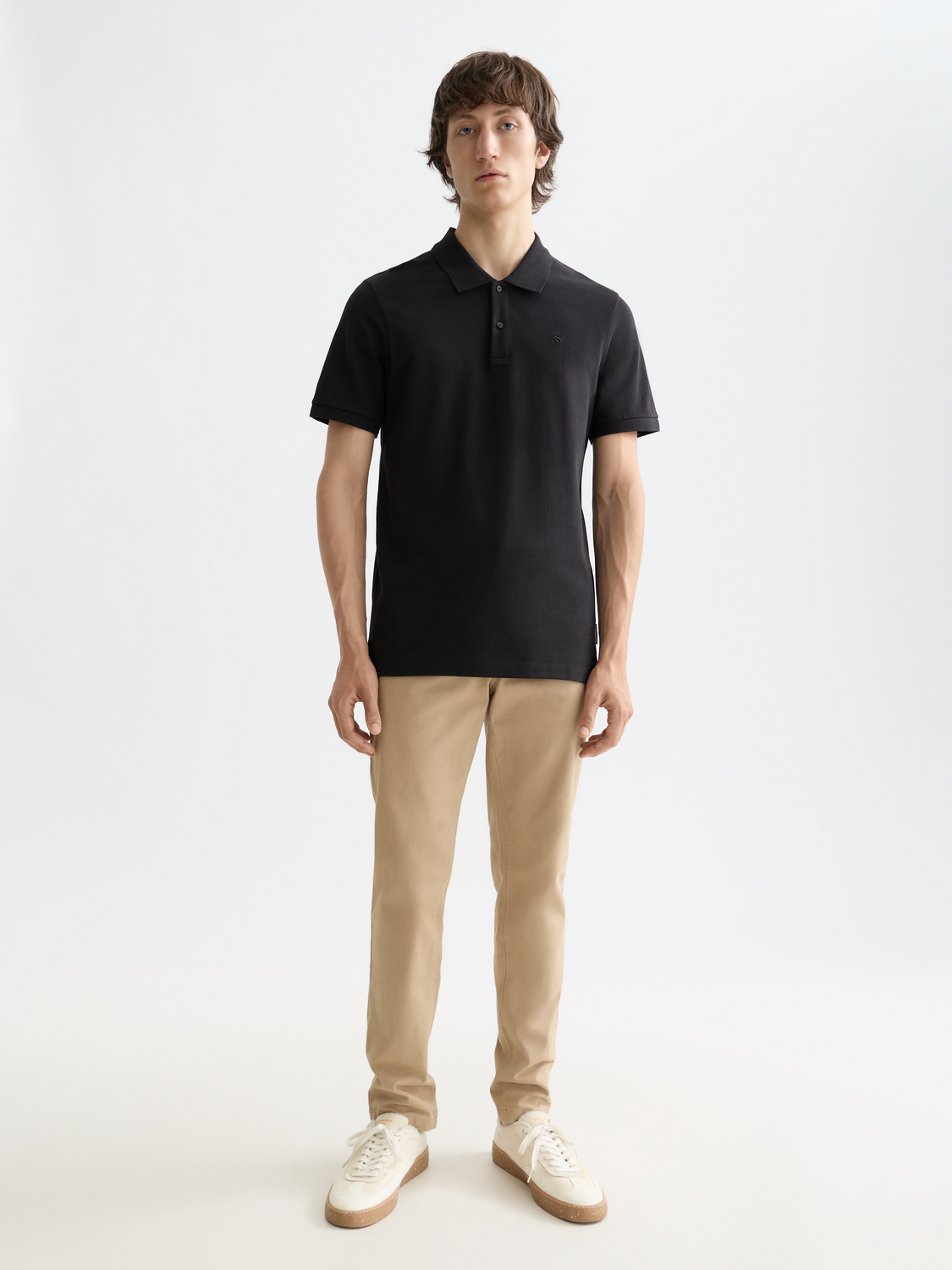 Navy Scotch & Soda logo pique polo shirt with classic collar and short sleeves, displayed on a hanger.