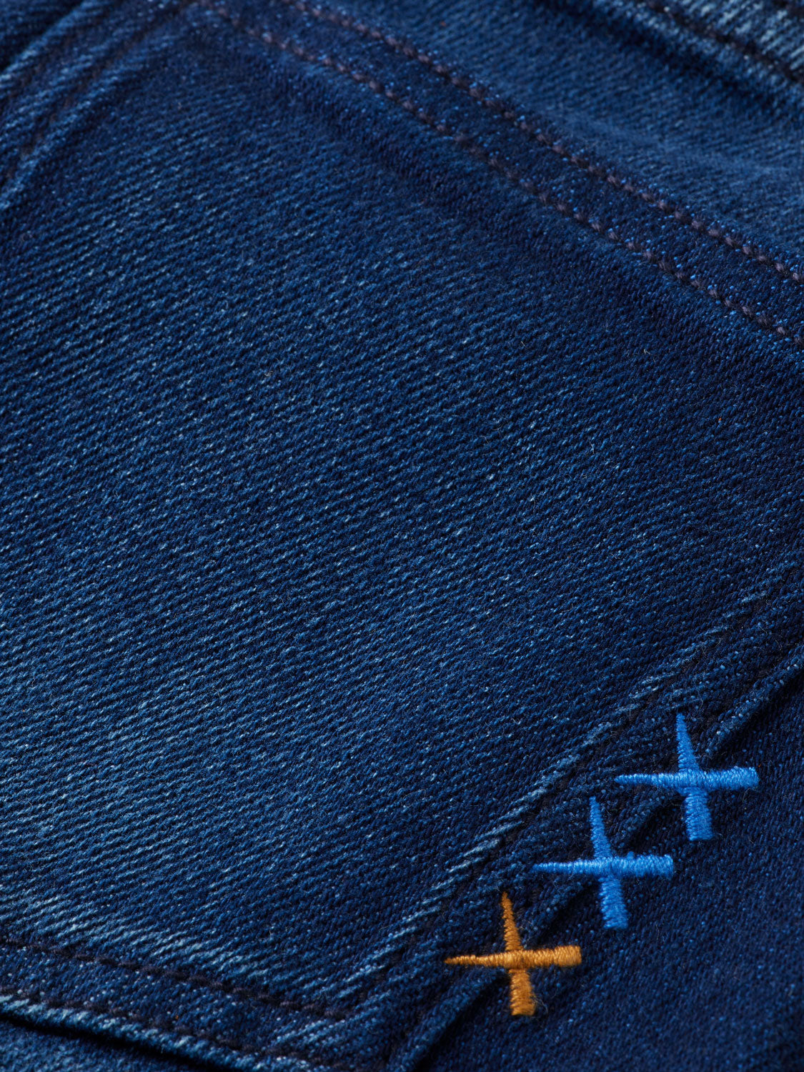 Kids' Scotch & Soda Dean tapered denim jeans, showing dark blue denim fabric with stitched details and adjustable waistband.