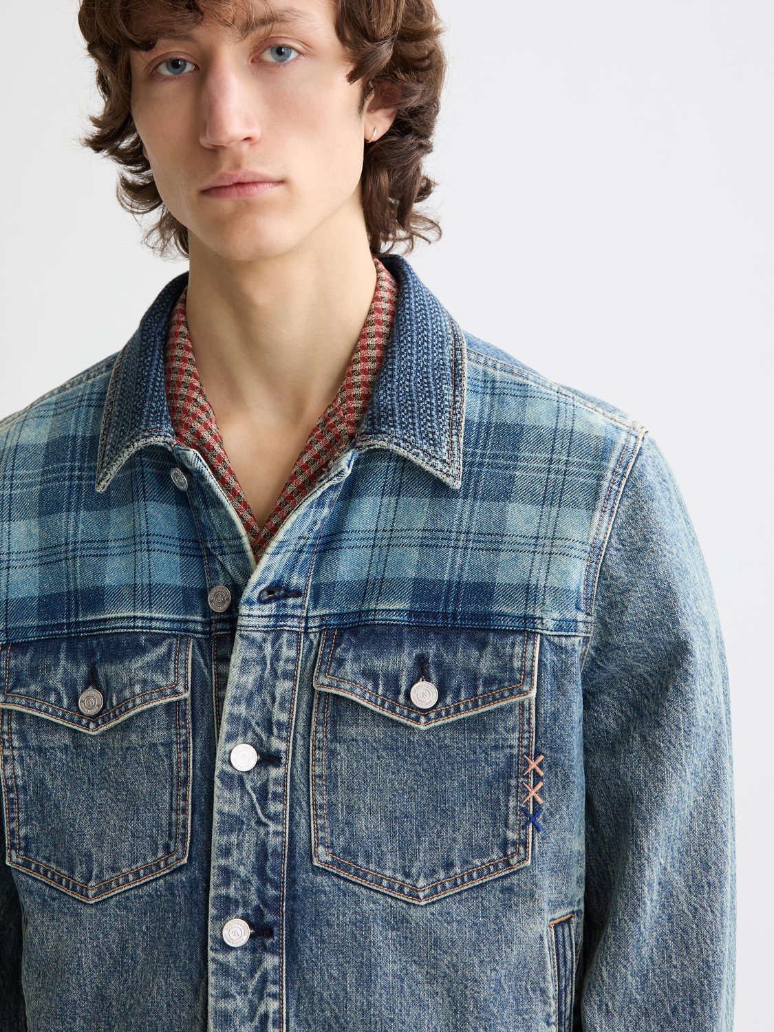 SCOTCH & SODA denim trucker jacket with classic fit, button front, and chest pockets, shown in a light wash denim.