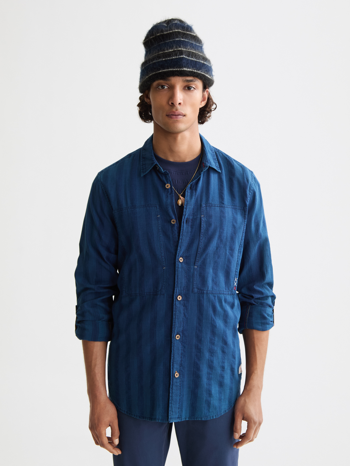 Textured indigo Scotch & Soda long-sleeve shirt with button collar and subtle pattern, displayed flat.