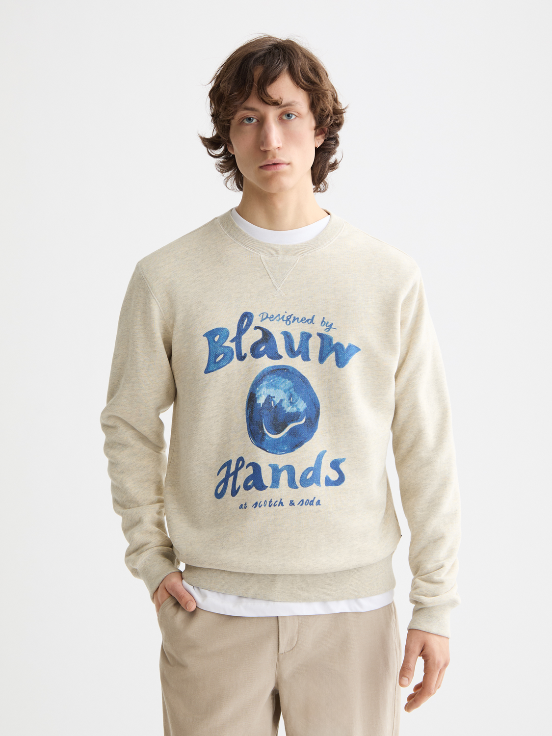 Washed artwork sweatshirt by Scotch & Soda featuring a casual design and soft fabric, displayed on a hanger.