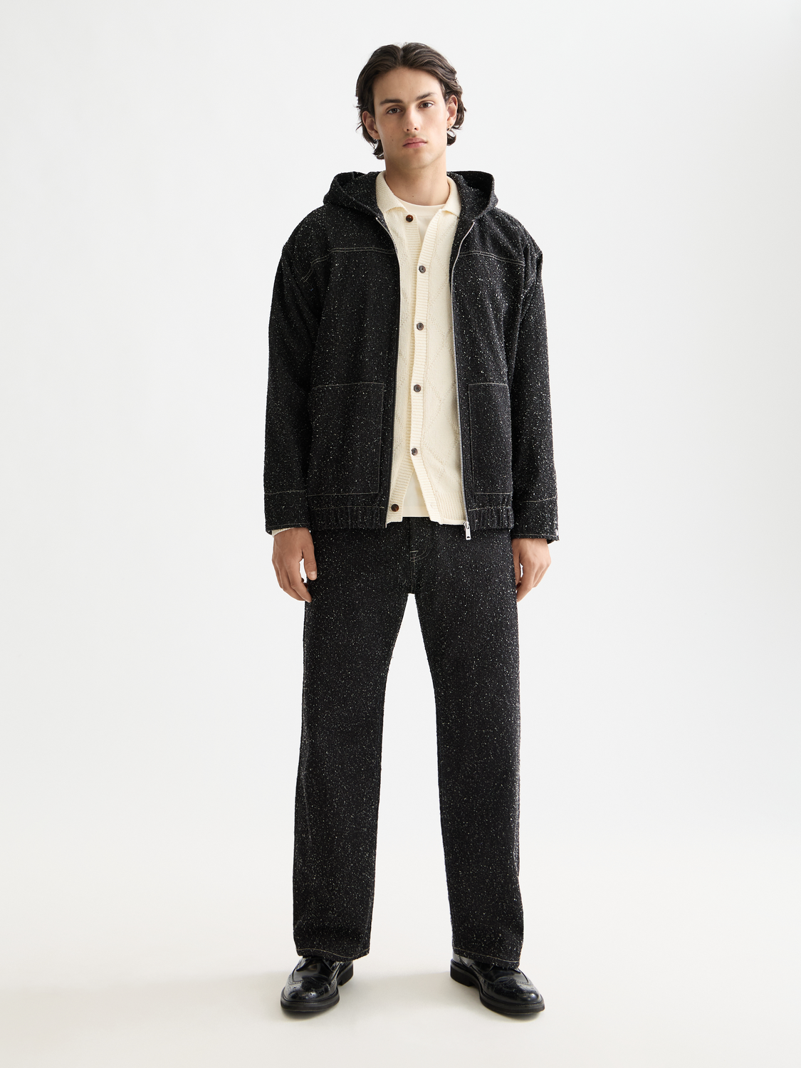 Blue denim jacket by Scotch & Soda with classic collar and button front, displayed on a hanger.
