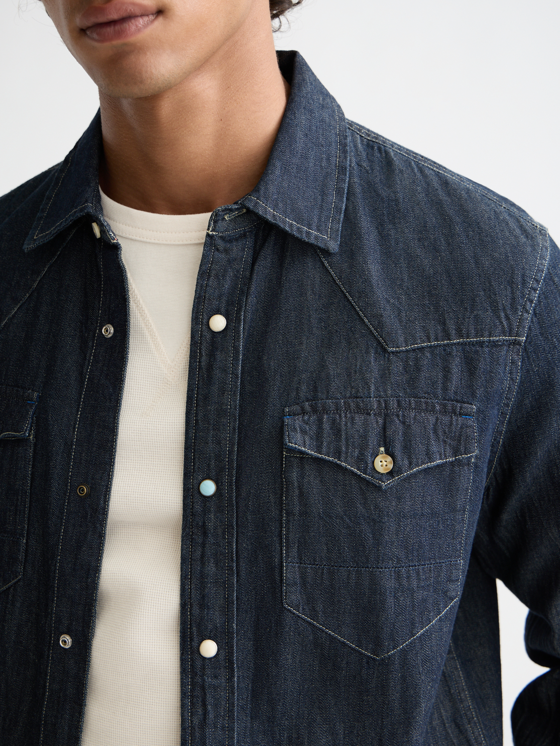 Long-sleeve Western shirt by Scotch & Soda with plaid pattern and button-down front, displayed on a hanger.