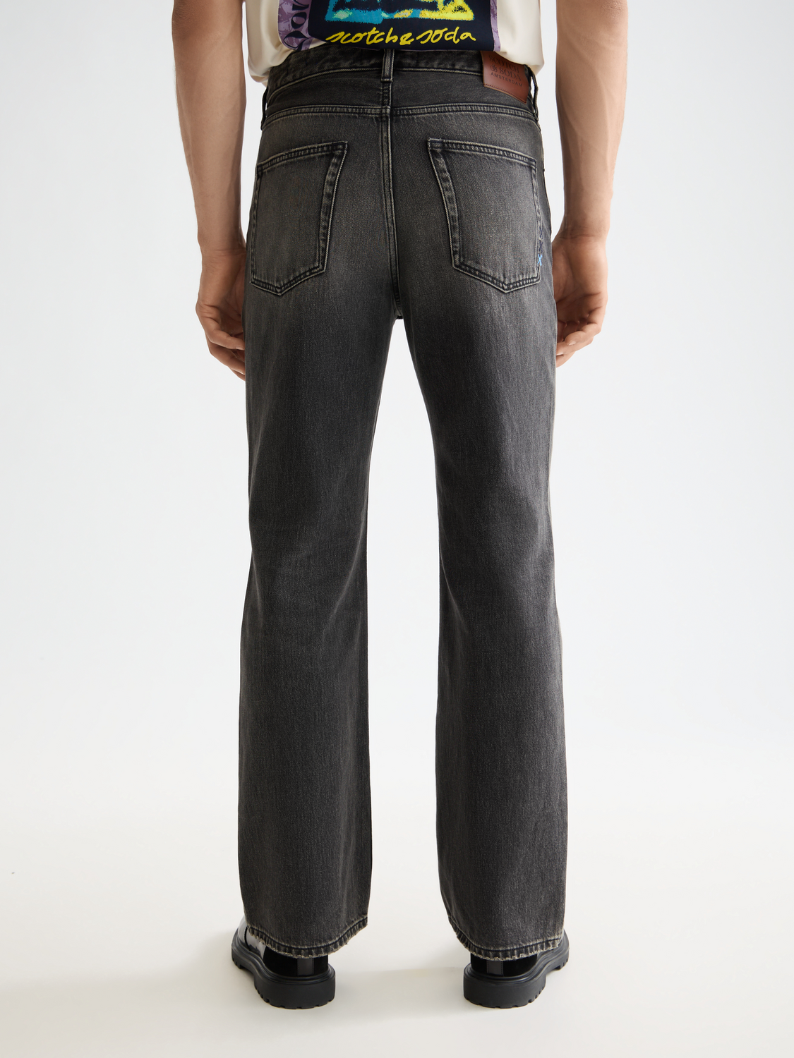 Back view of Scotch & Soda Beat wide-fit denim jeans showing classic blue denim and relaxed fit.
