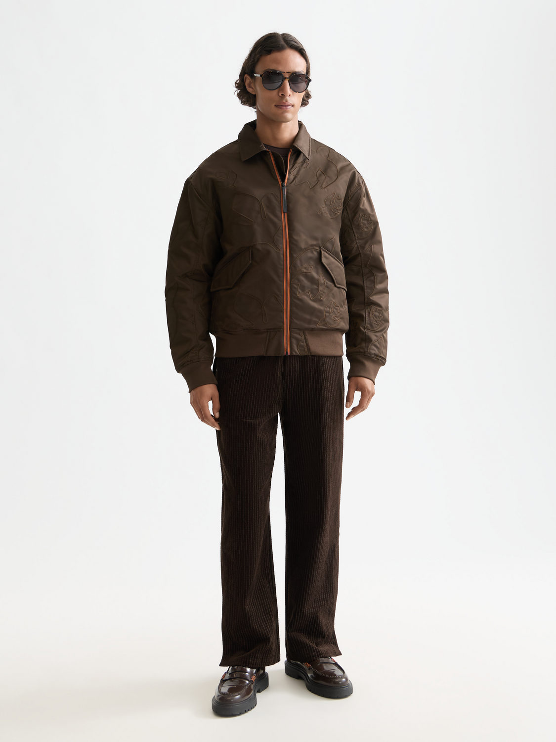 SCOTCH & SODA aviator bomber jacket with quilted lining and front zipper, shown on a hanger with a neutral background.