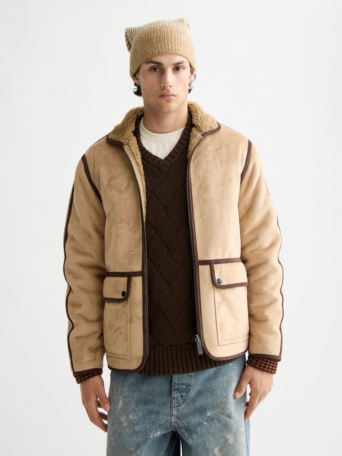 SCOTCH & SODA faux shearling jacket showing a plush, cream-colored exterior with a front zipper and stylish collar.