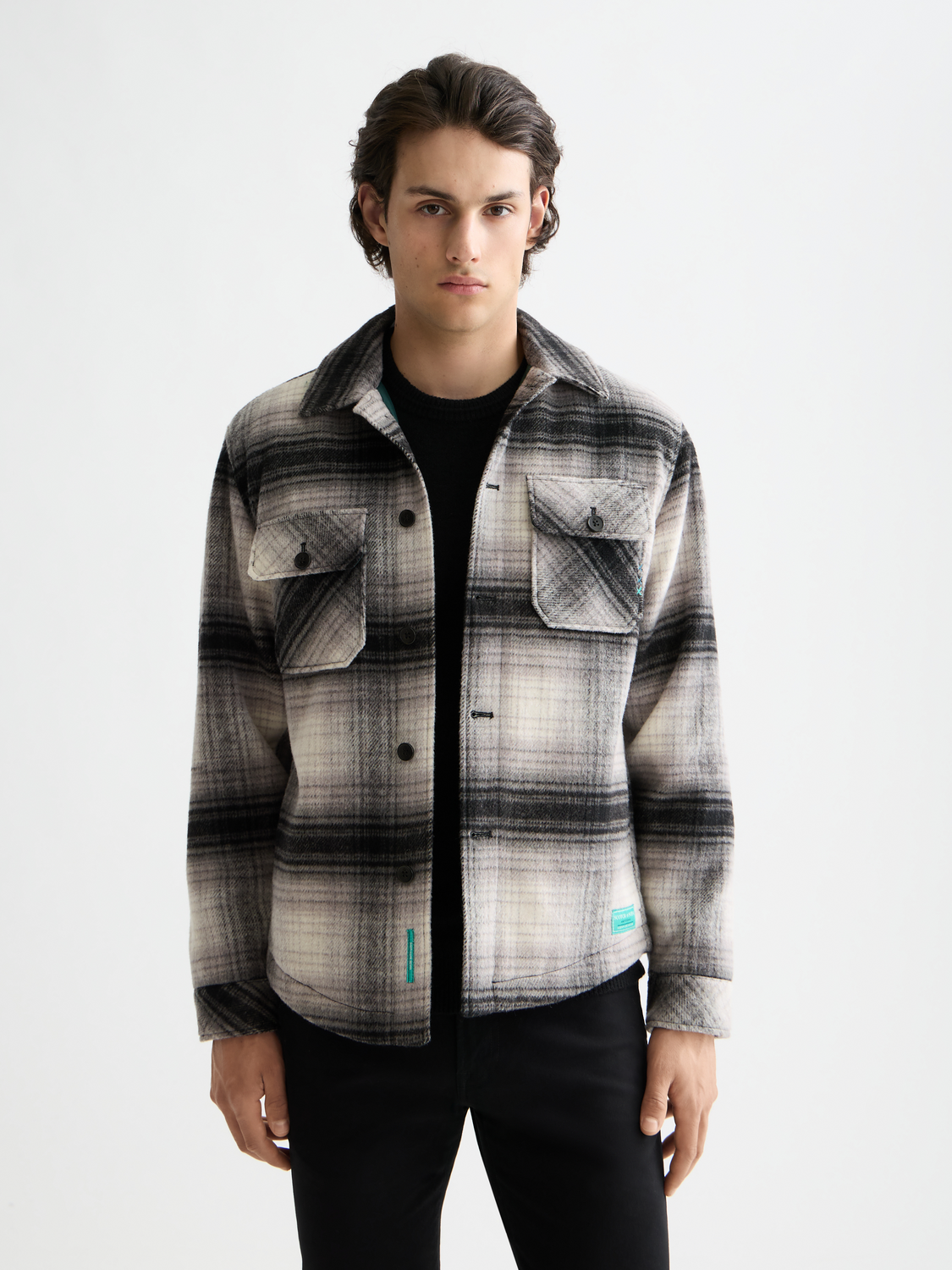 Scotch & Soda check overshirt jacket with button front and collar, featuring a classic plaid pattern in neutral tones.
