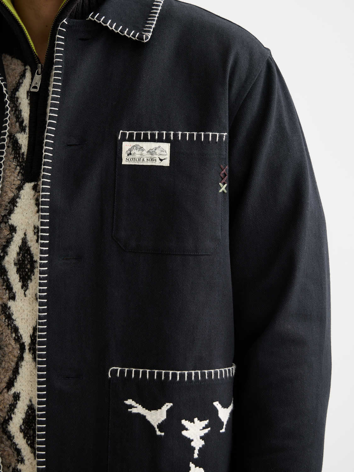 Embroidered worker jacket by Scotch & Soda featuring detailed embroidery, front pockets, and a casual fit.