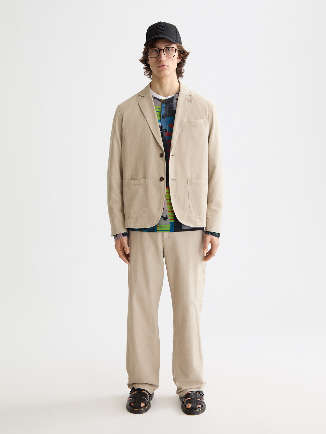 Relaxed-fit blazer by Scotch & Soda featuring a tailored design, worn open with lapel collar and long sleeves.