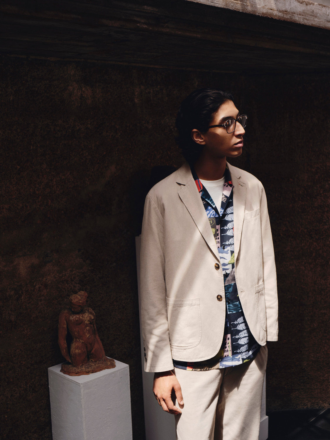 Relaxed-fit Scotch & Soda blazer displayed on a hanger, showing its tailored design and classic lapel in a neutral color.