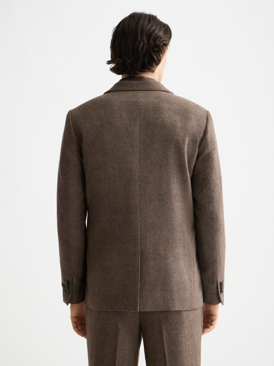 Yarn-dyed blazer by Scotch & Soda featuring a tailored fit, classic lapel, and textured fabric in a stylish design.
