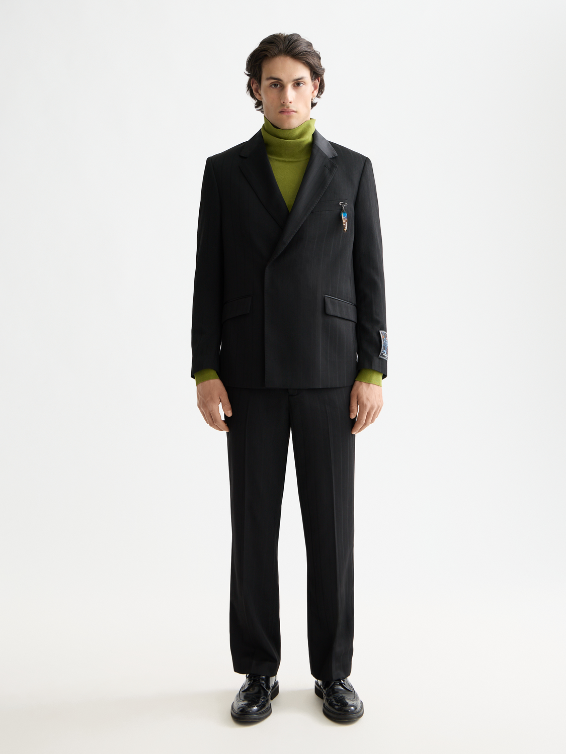 Navy Scotch & Soda double-breasted blazer with peak lapels and structured fit, displayed on a hanger.