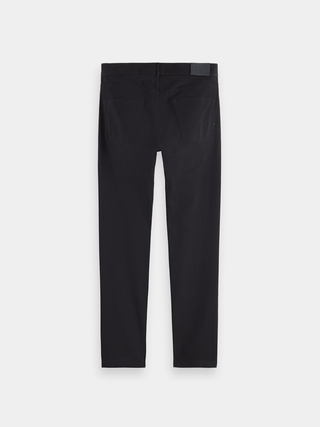 Black Ralston slim-fit 5-pocket pants by Scotch & Soda displayed on a model against a white background.