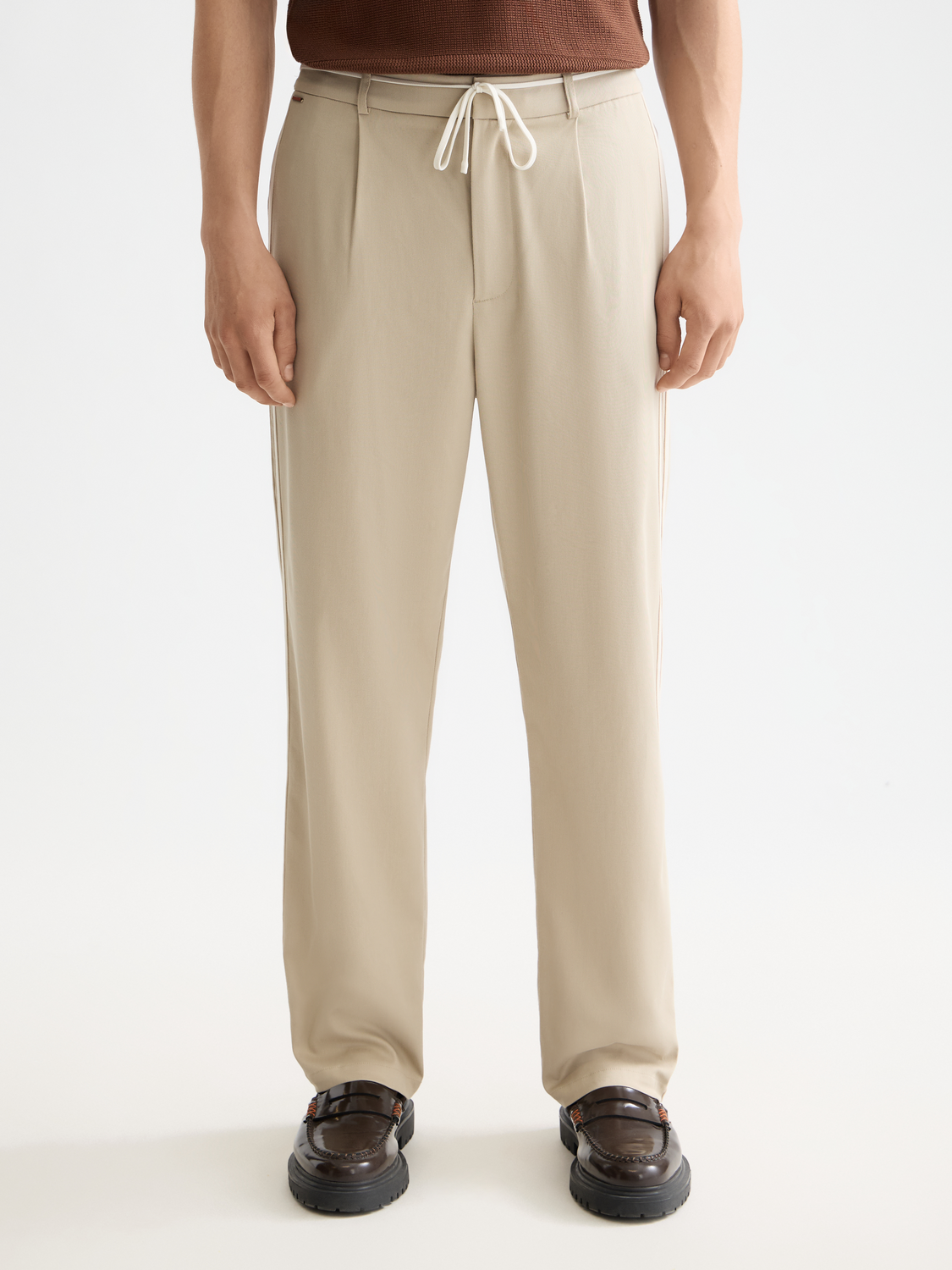 Pleated straight-fit jogger pants by Scotch & Soda, featuring a stylish design with pleats and a relaxed fit.
