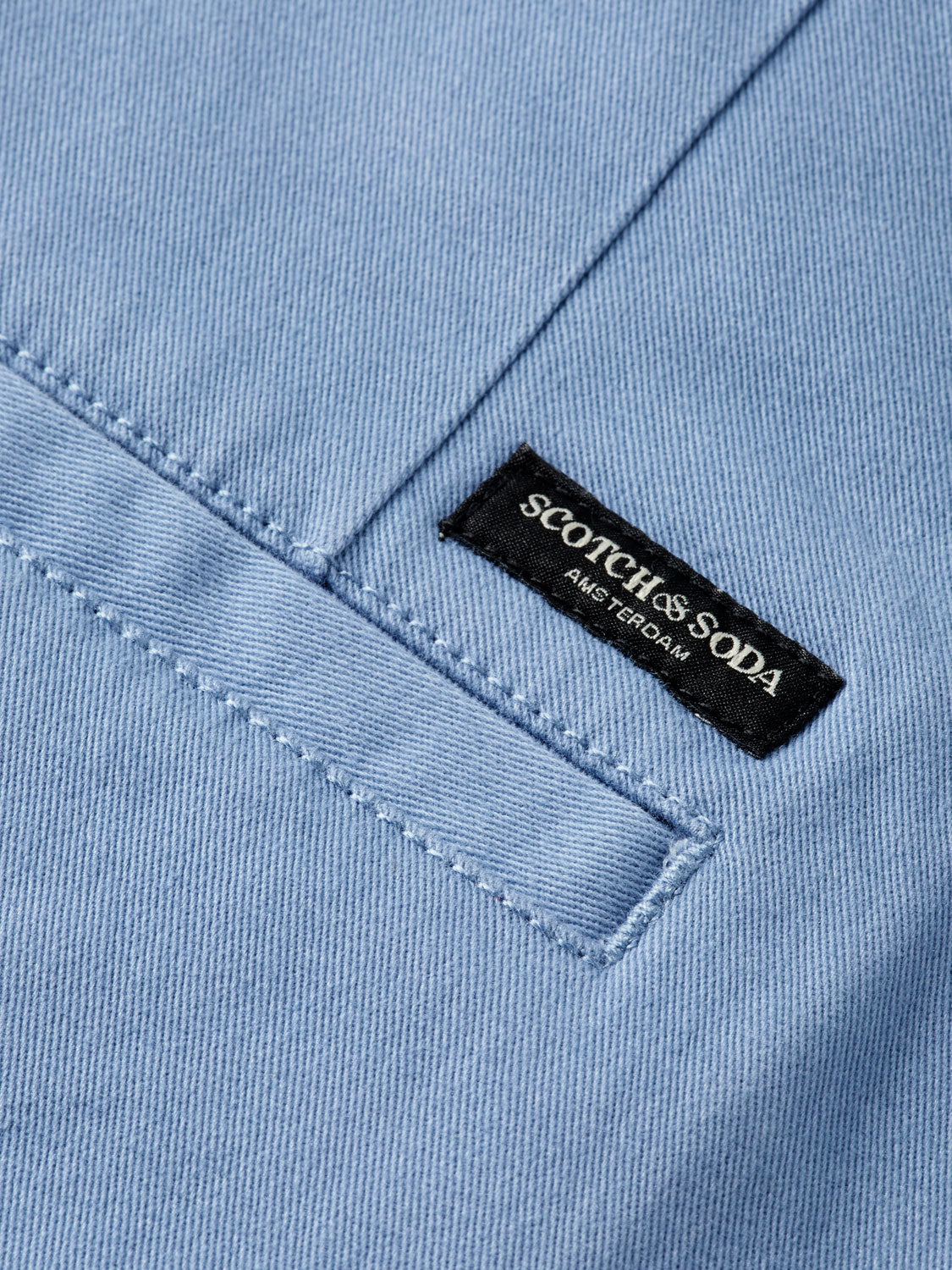 Slim-fit Mott chinos by Scotch & Soda, stylish men's pants in classic color, displayed on a neutral background.