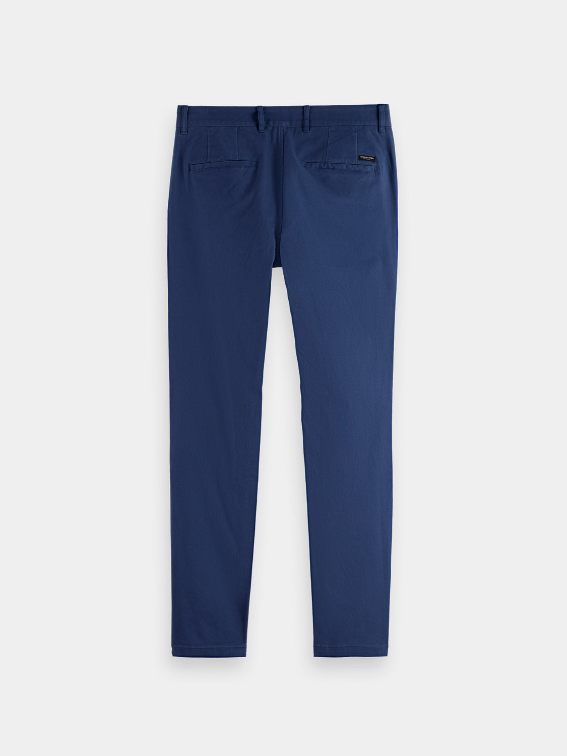 Dark navy Mott slim-fit chinos pants by Scotch & Soda with a flat front and classic fit, shown on a hanger.