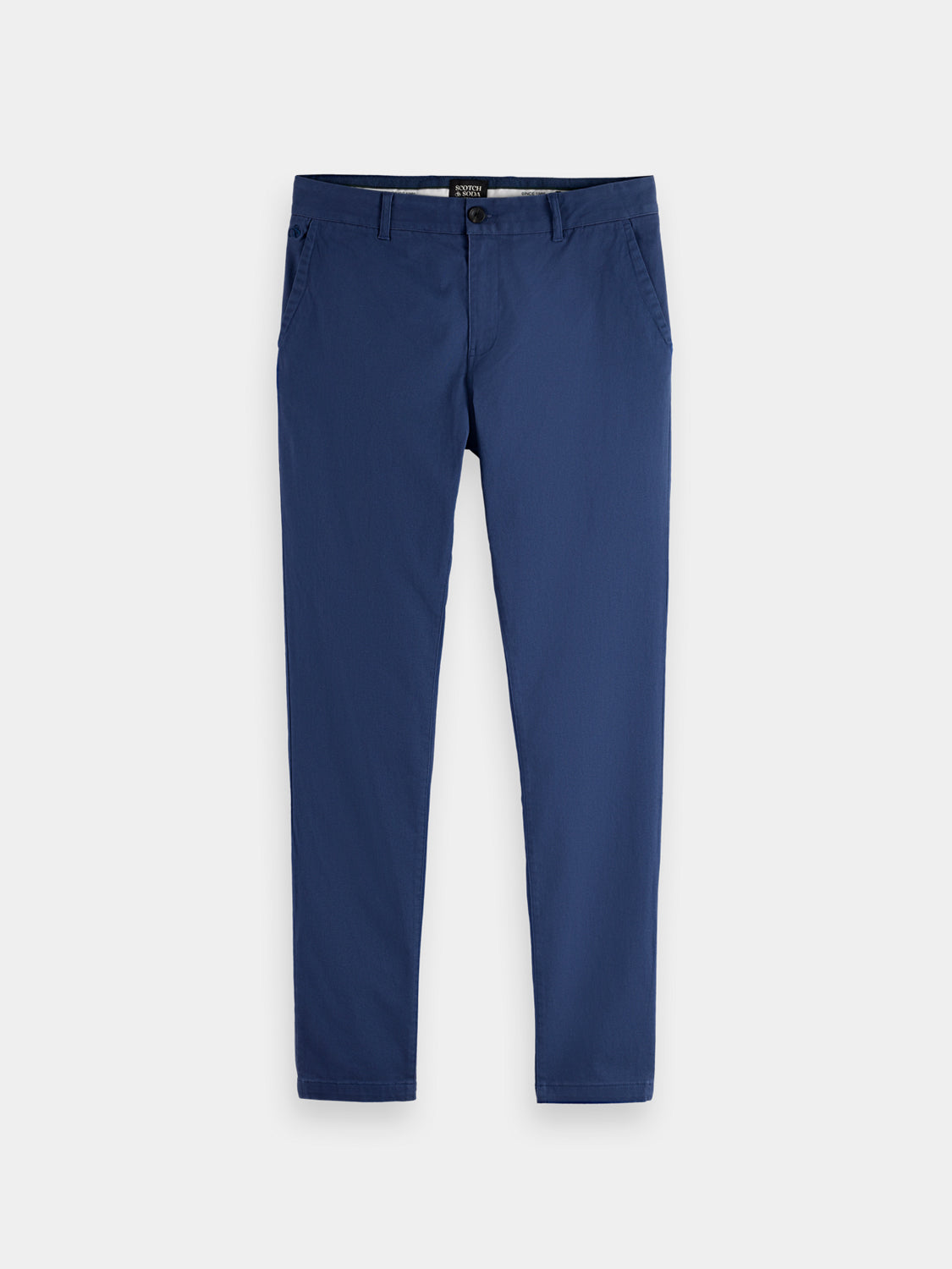 Slim-fit Mott chinos by Scotch & Soda, showing beige pants with a flat front and belt loops on a hanger.