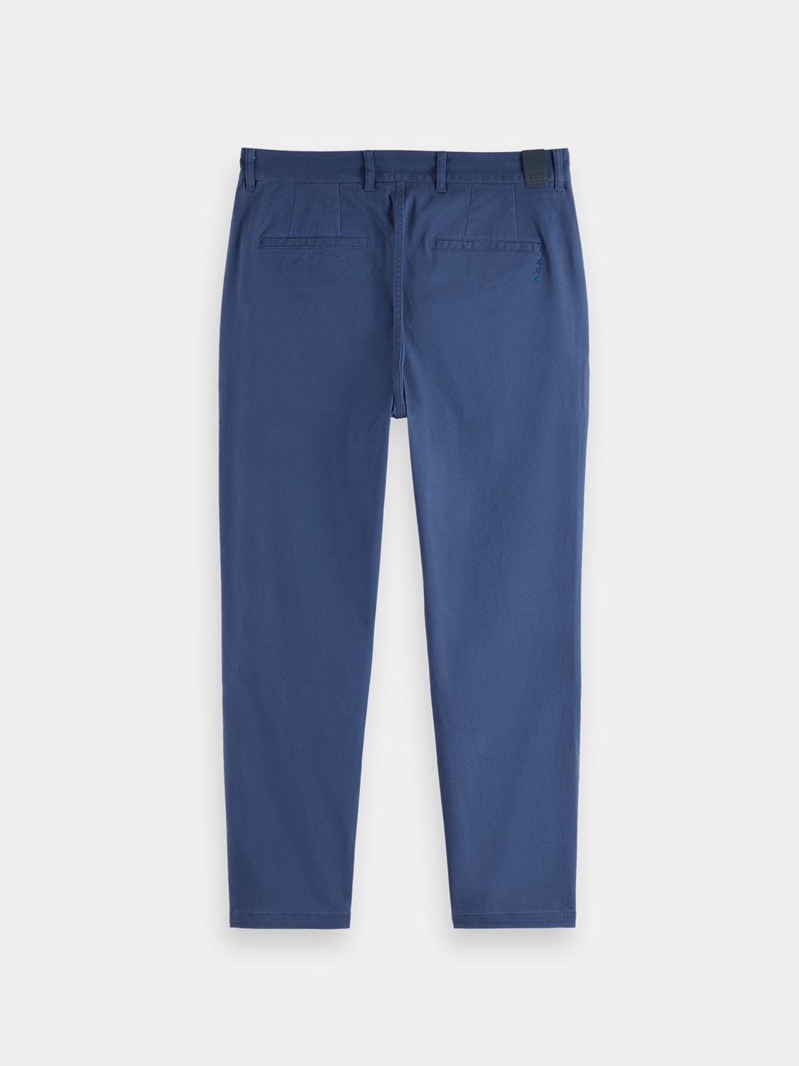SCOTCH & SODA Drift tapered chinos, men's pants in dark color, with slim fit and casual style, shown on a model.