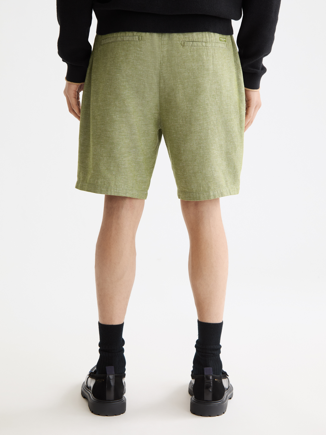 SCOTCH & SODA Fave cotton-linen shorts shown from the back, featuring a relaxed fit and light fabric for casual summer wear.