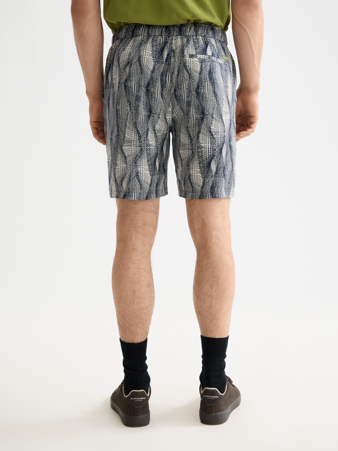 Scotch & Soda Fave printed shorts with colorful floral and abstract pattern, back view showing relaxed fit and vibrant design.