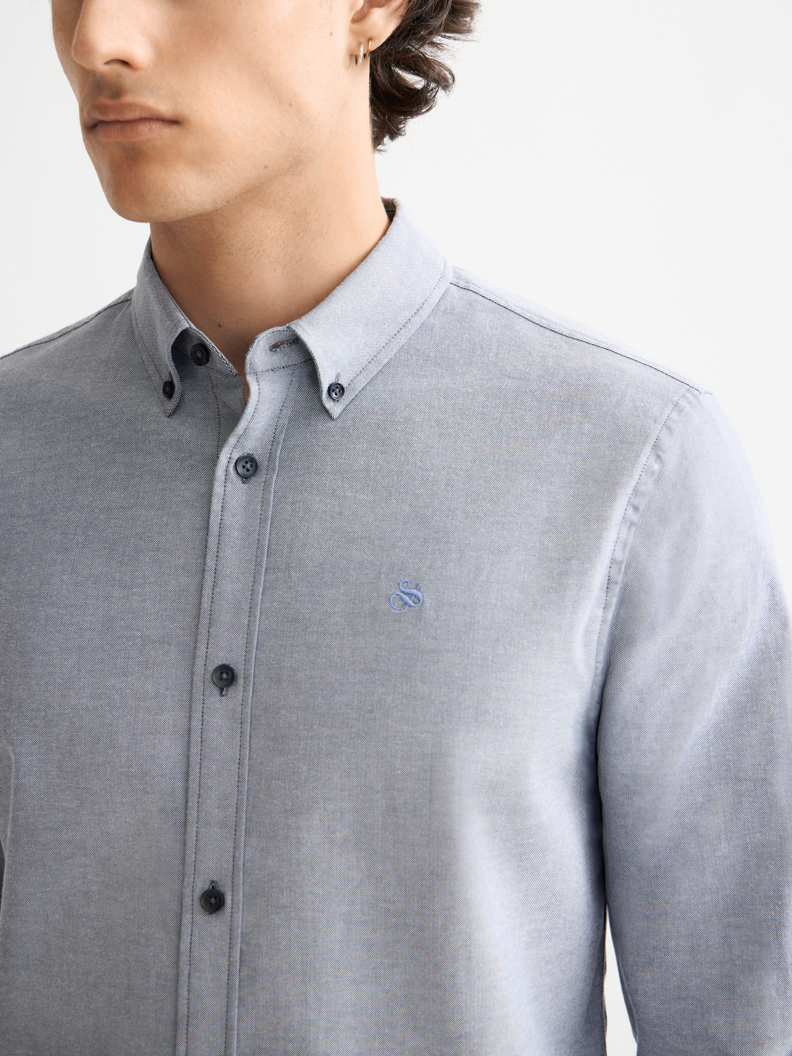 Blue long-sleeve Oxford shirt by Scotch & Soda, with a classic collar and button-down front, displayed on a plain background.