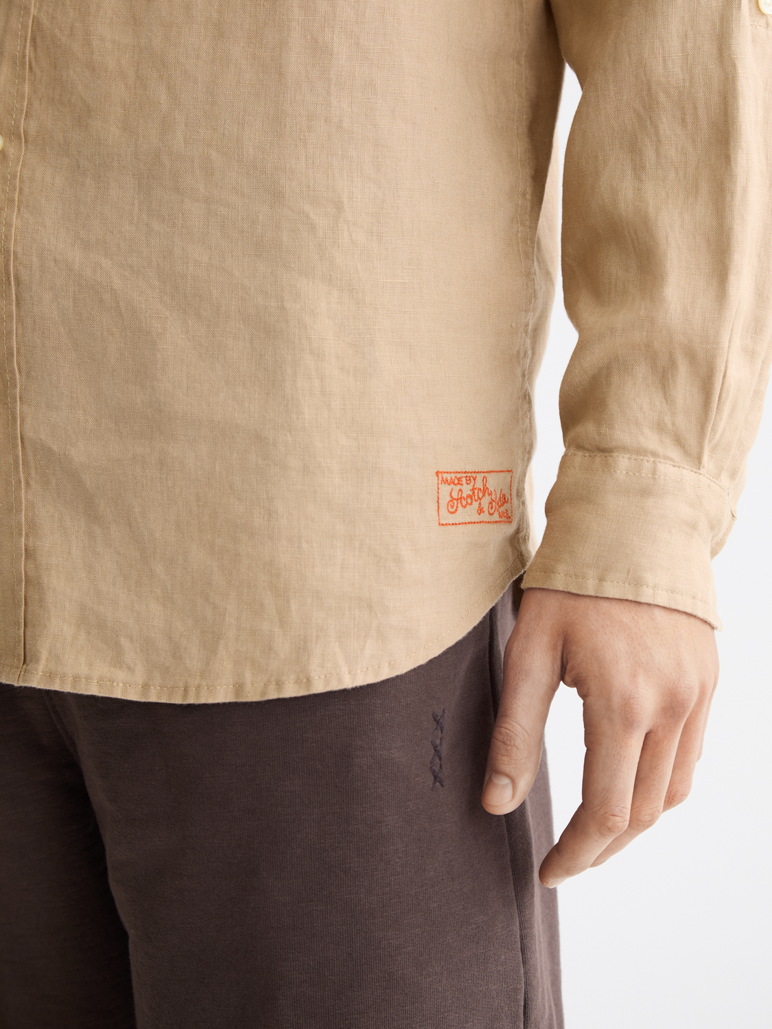 Long-sleeve linen shirt by Scotch & Soda, lightweight and breathable with a casual fit, shown on a hanger.