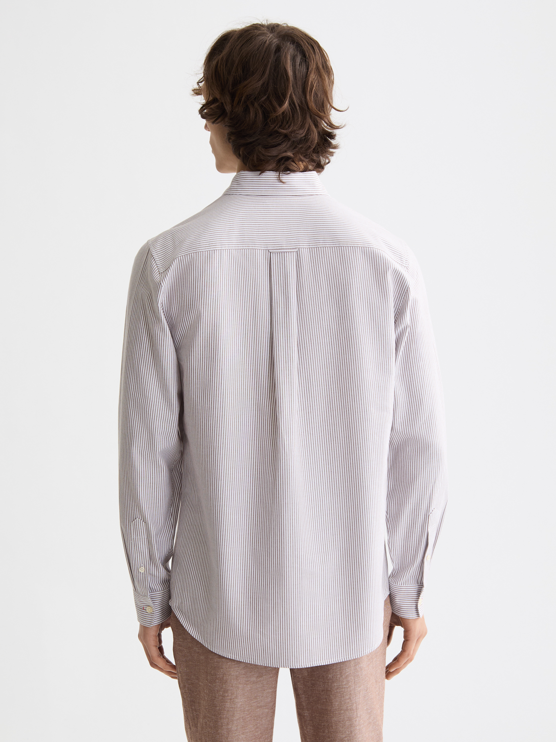 Long sleeve striped Oxford shirt by Scotch & Soda, showing the back view with blue and white stripes and button-down collar.