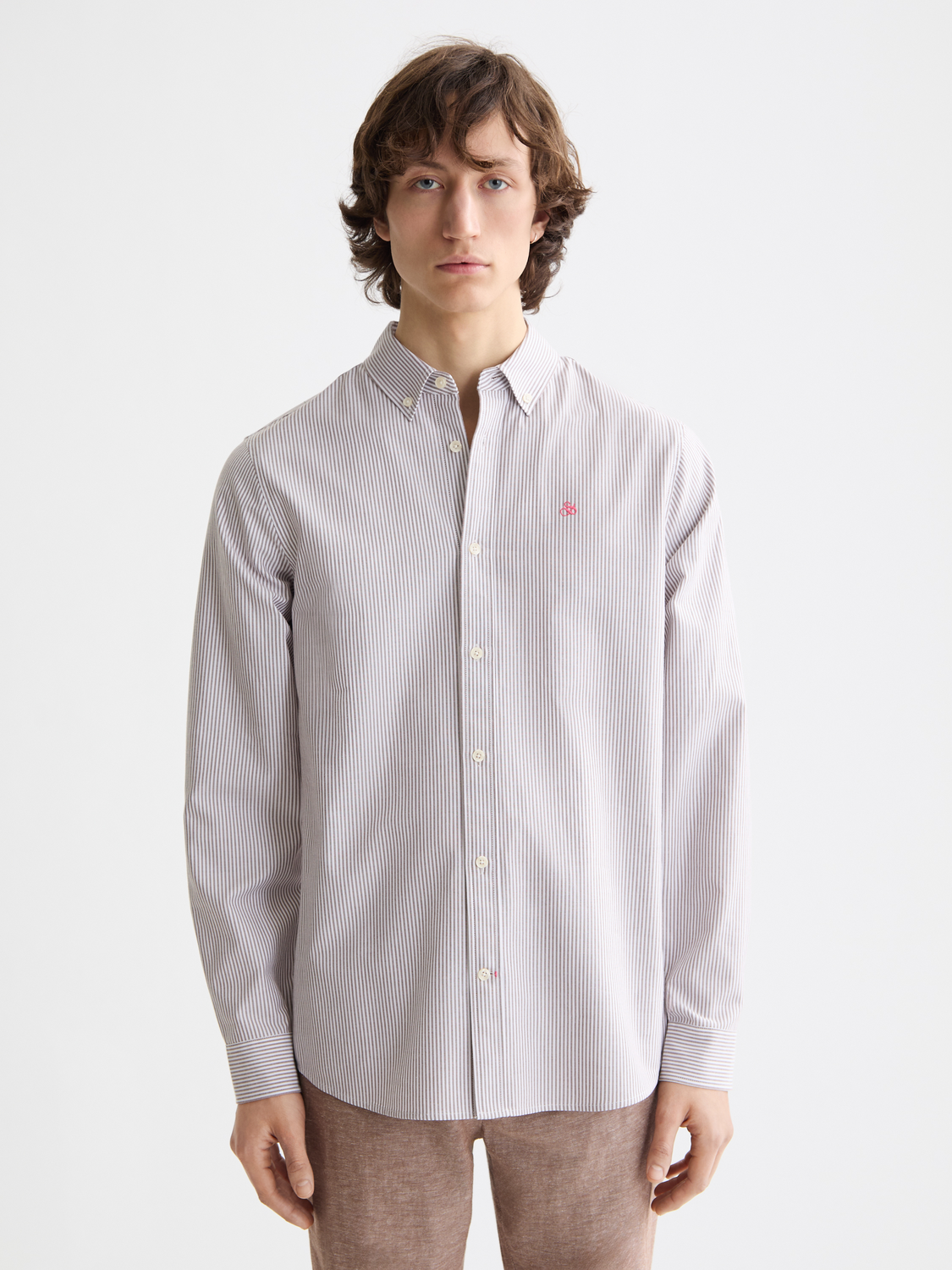 Long-sleeve striped Oxford shirt by Scotch & Soda, featuring classic collar and button-down front on a plain background.