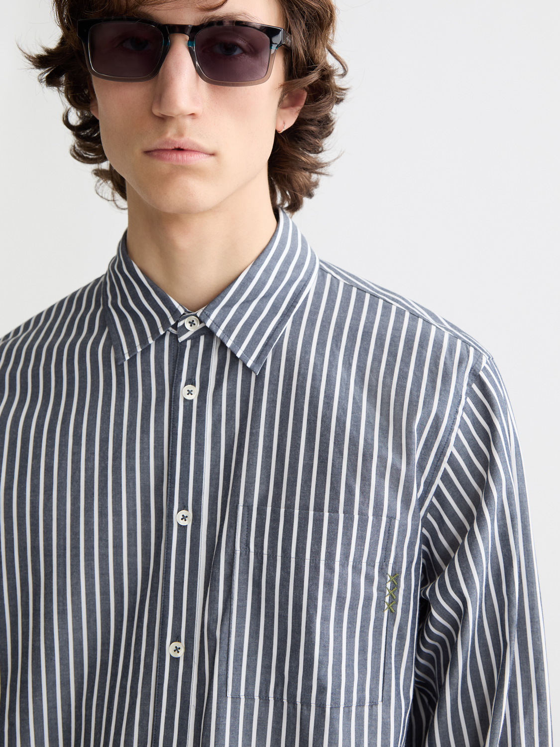 Long-sleeve Scotch & Soda striped poplin shirt with blue and white vertical stripes, button-up front, and classic collar.