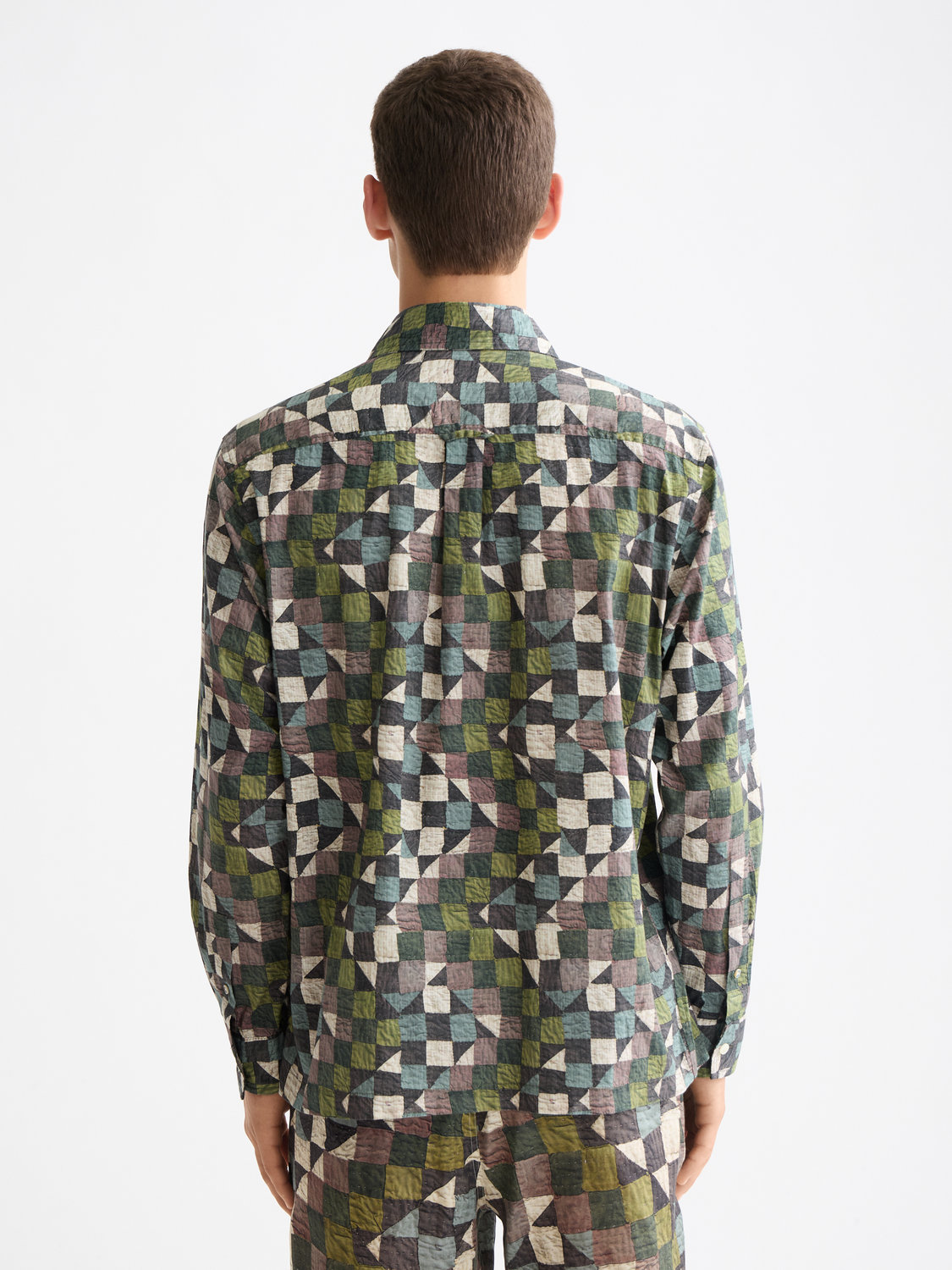 Long-sleeve printed shirt by Scotch & Soda featuring a vibrant floral pattern and casual fit, shown from the back.