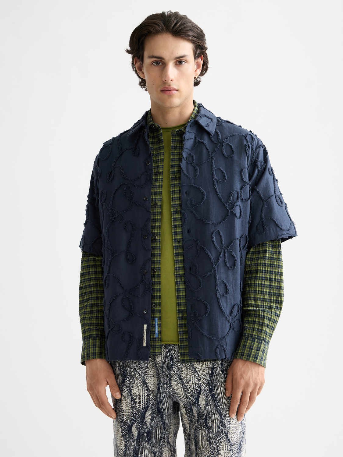 Scotch & Soda jacquard short-sleeved shirt with intricate woven pattern and button front, model facing forward.