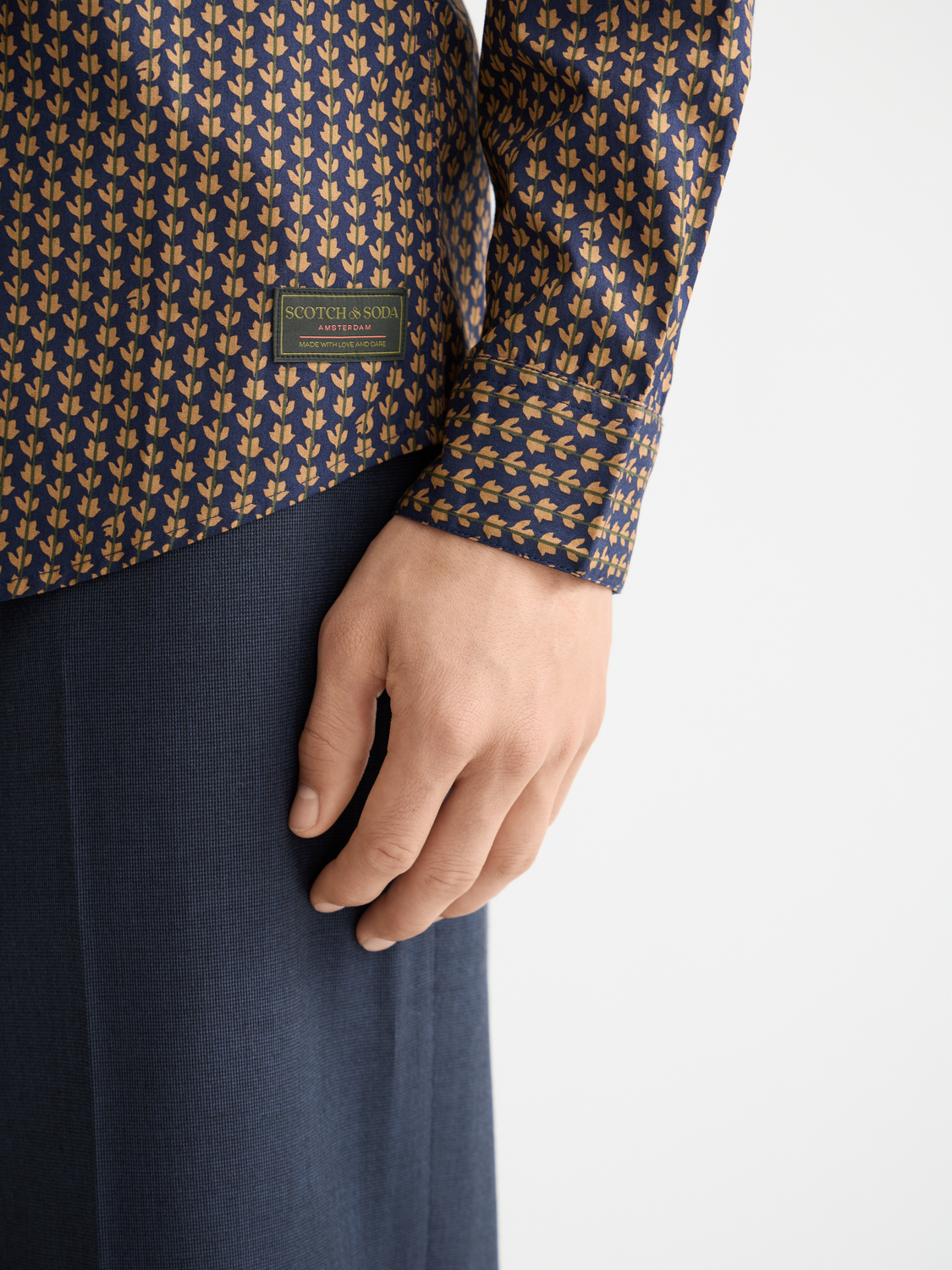 Long sleeve printed shirt by Scotch & Soda featuring colorful floral patterns on soft fabric.