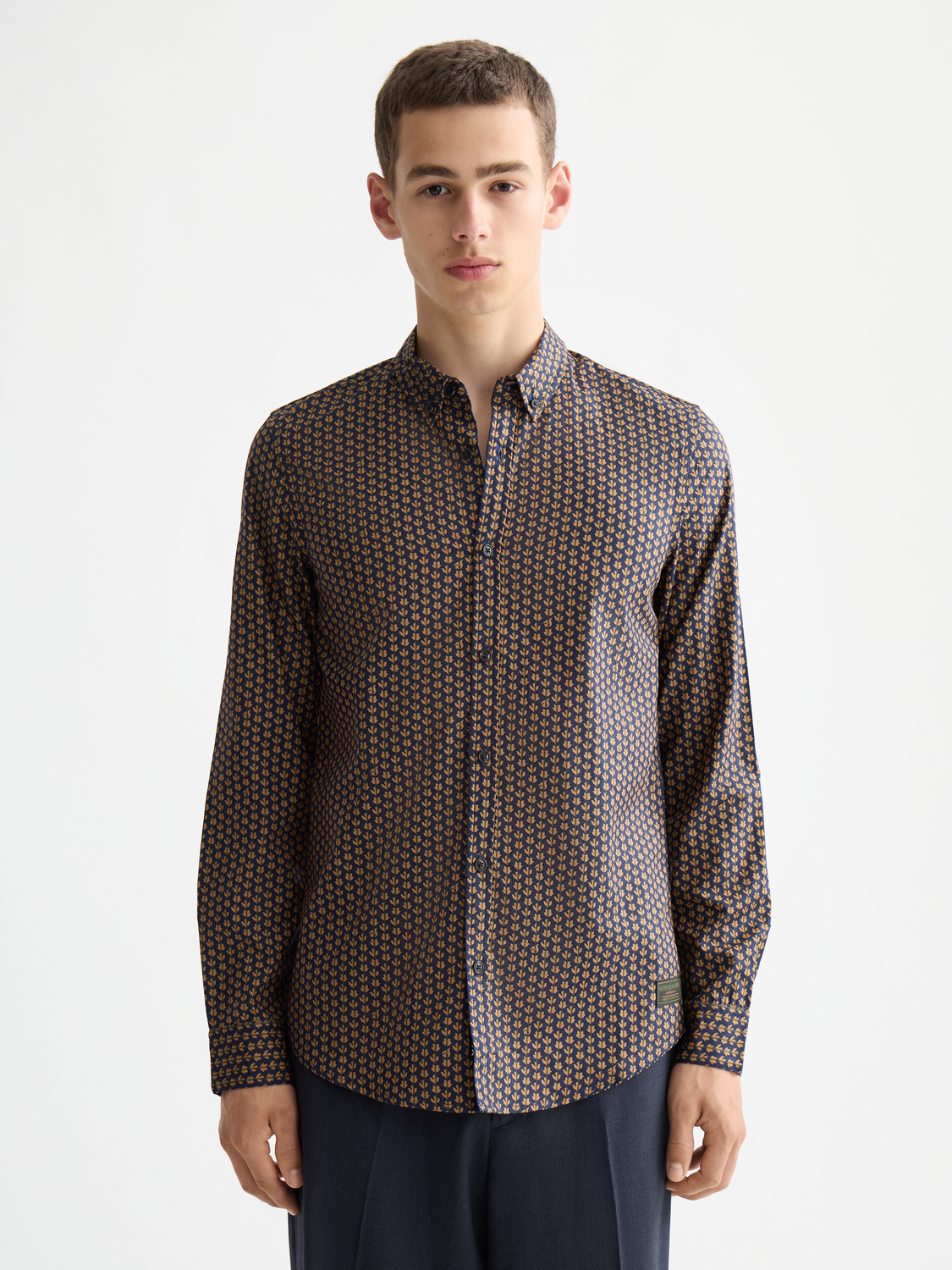 Long sleeve printed shirt by Scotch & Soda featuring a stylish pattern, showcased on a flat lay with buttons and collar visible.