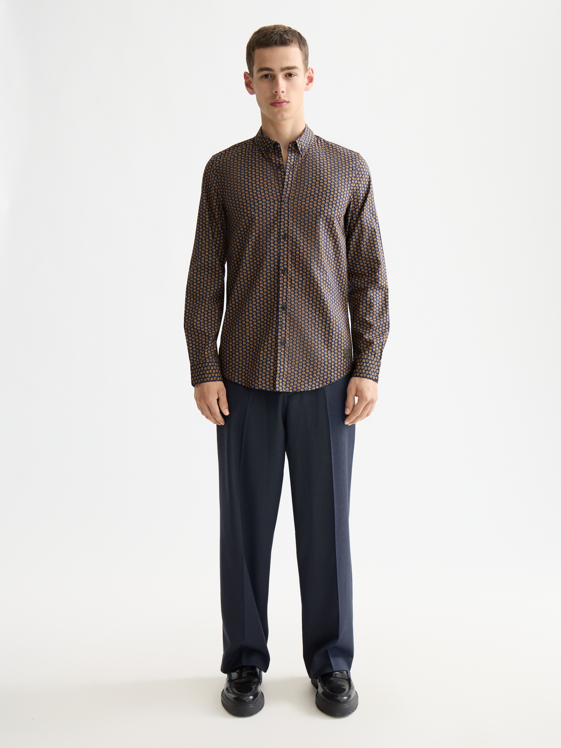 Long-sleeve printed shirt from Scotch & Soda featuring vibrant patterns and a casual fit, displayed on a neutral background.