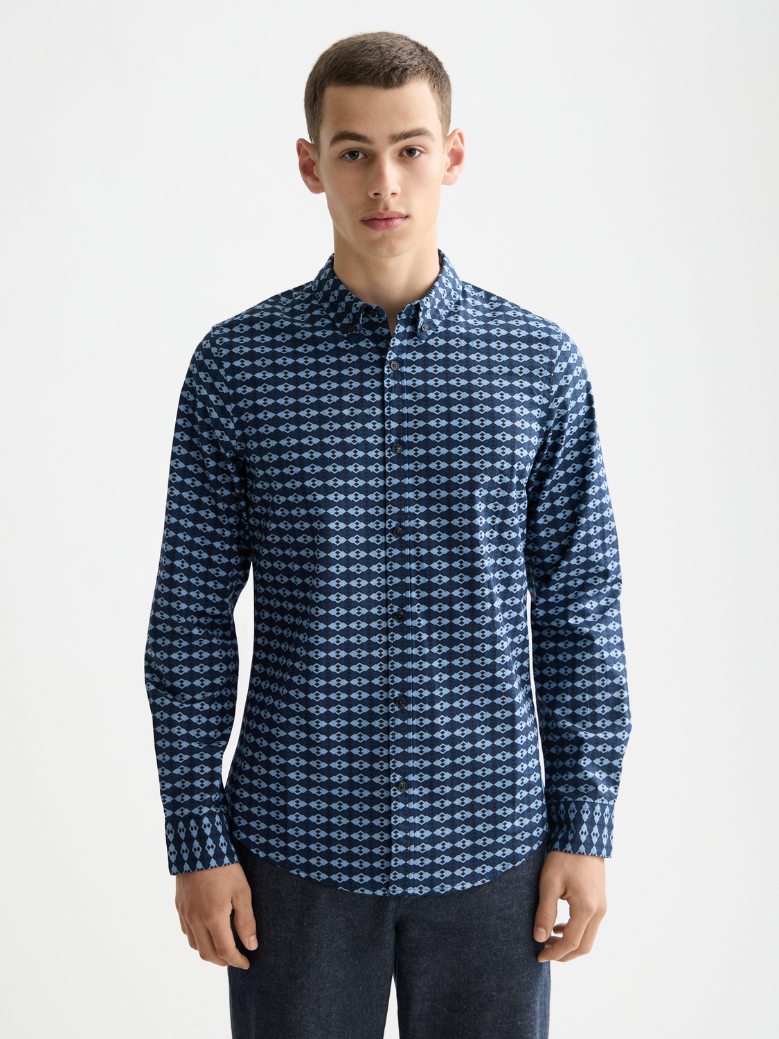 Long-sleeve printed shirt by Scotch & Soda featuring vibrant floral patterns and a casual fit, pictured on a white background.