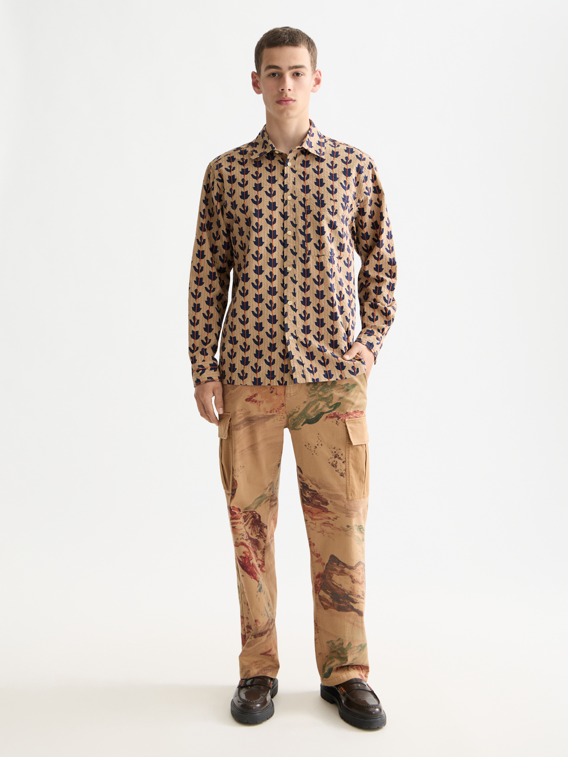 Long sleeve printed shirt by Scotch & Soda, featuring colorful patterns and a classic fit, shown on a hanger.