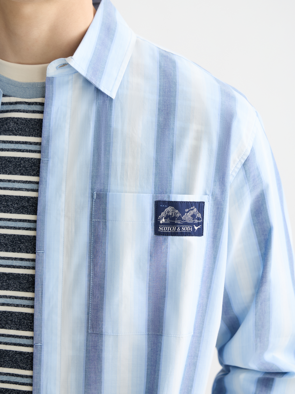 Long-sleeve Scotch & Soda striped shirt with blue, white, and red horizontal stripes, casual style, front view.