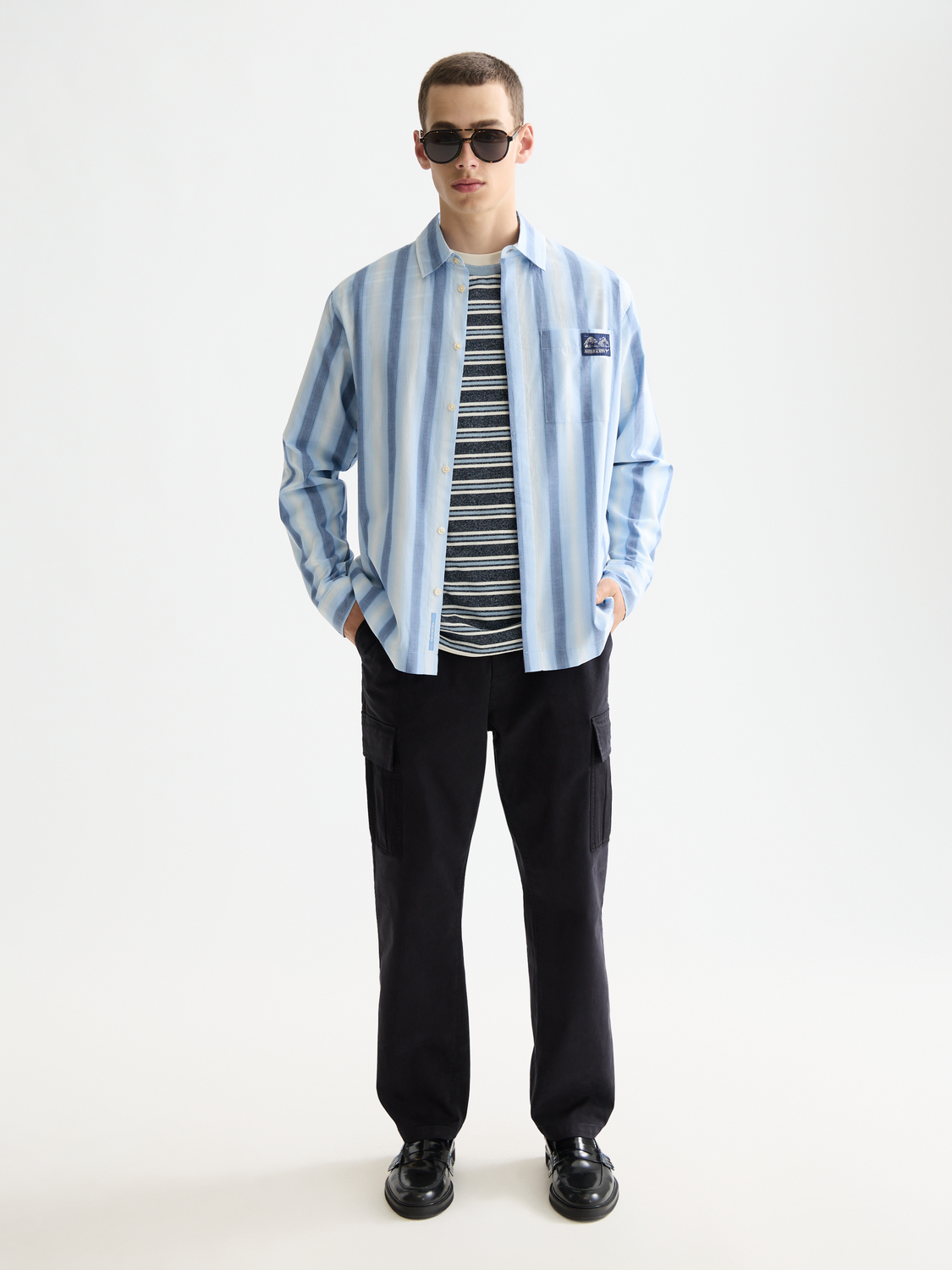 Long-sleeve striped shirt by Scotch & Soda, featuring a classic pattern and modern fit, shown on a model.