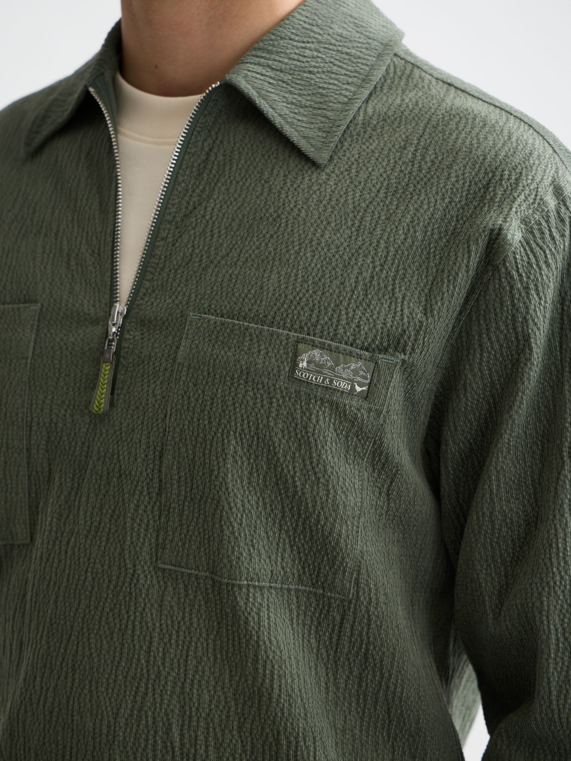 Scotch & Soda men's long sleeve quarter zip corduroy shirt in earthy brown with textured fabric and collar detail.