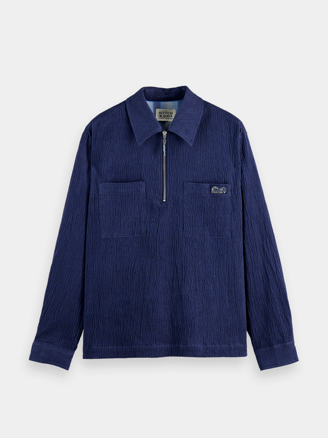 Long sleeve Scotch & Soda corduroy quarter zip shirt in a stylish, textured fabric, shown in a close-up view.