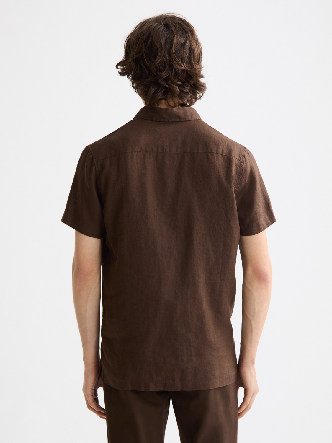Light blue Scotch & Soda short-sleeved linen shirt with a relaxed fit, displayed on a hanger against a plain background.
