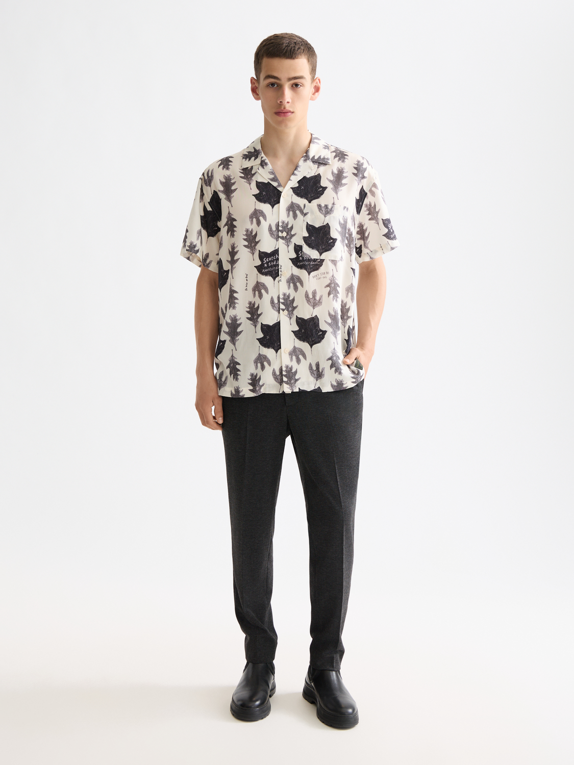 Printed Scotch & Soda short-sleeved shirt with vibrant pattern, casual fit, and button-front design.