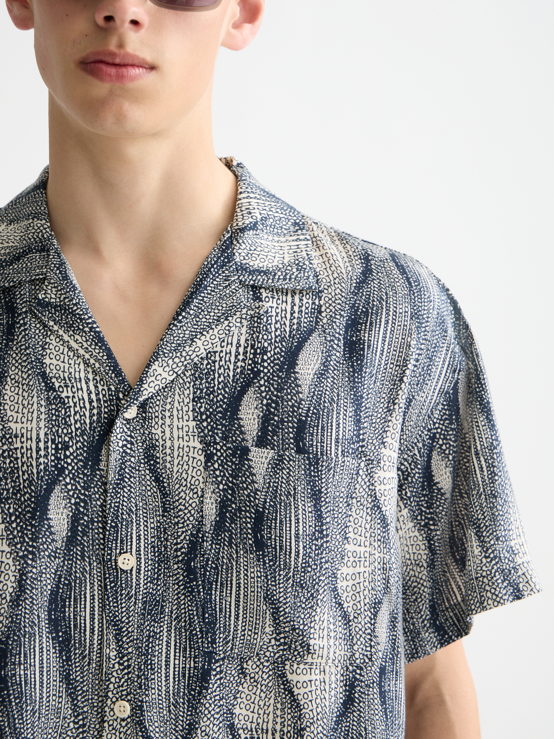 Printed short-sleeved shirt from Scotch & Soda featuring a colorful floral pattern and classic collar design.