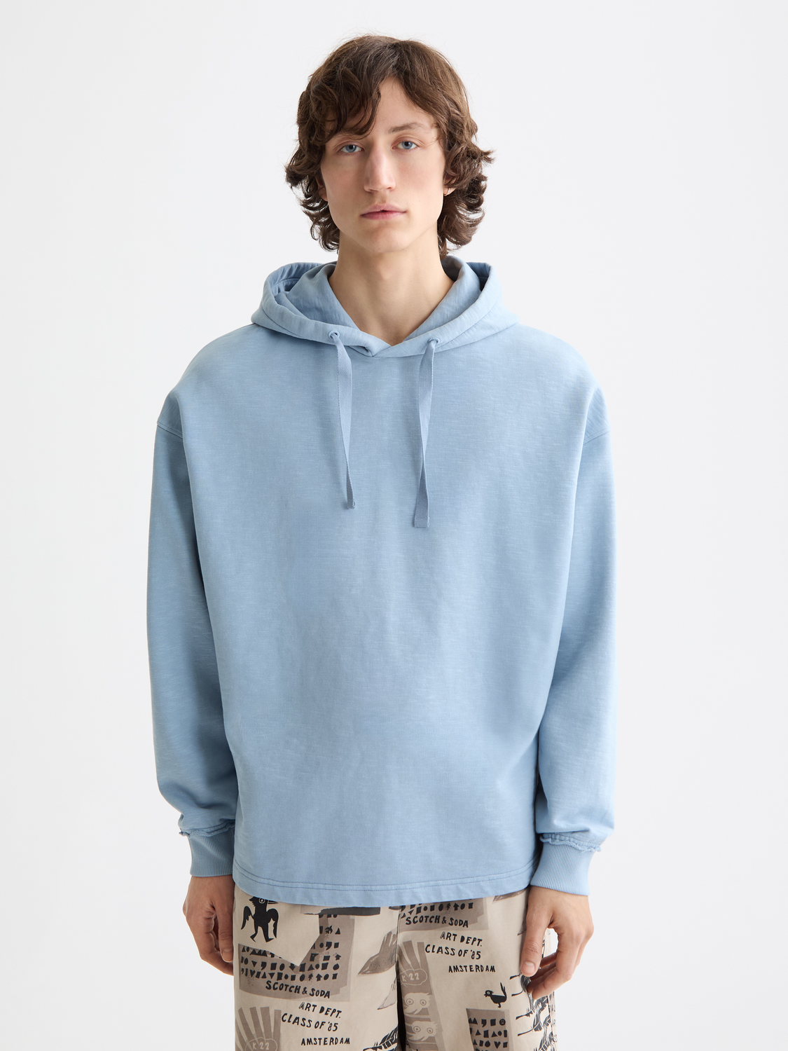 Gray garment-dyed hoodie from SCOTCH & SODA, featuring a front view with a relaxed fit and soft fabric for casual wear.