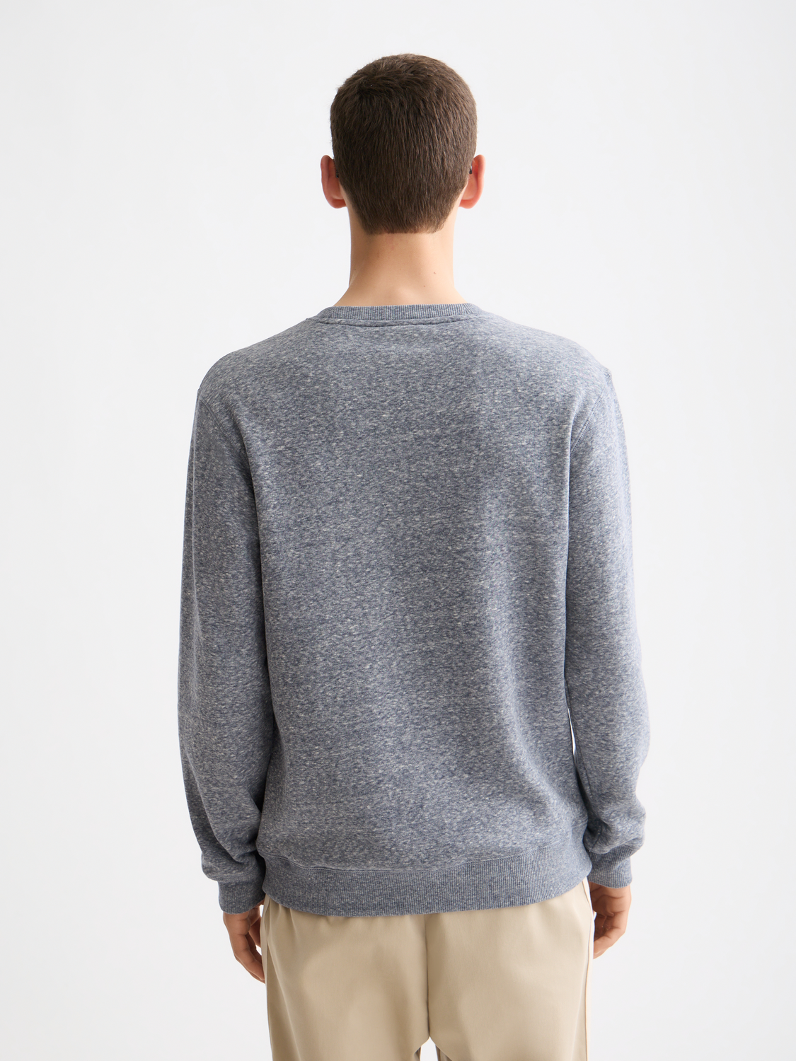 Scotch & Soda Melange sweatshirt displaying a cozy, multicolored knit with a relaxed fit and ribbed cuffs and hem.