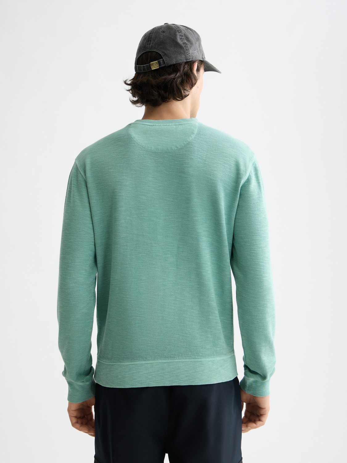Scarlet garment-dyed sweatshirt from Scotch & Soda, showing the back view with soft fabric and relaxed fit.